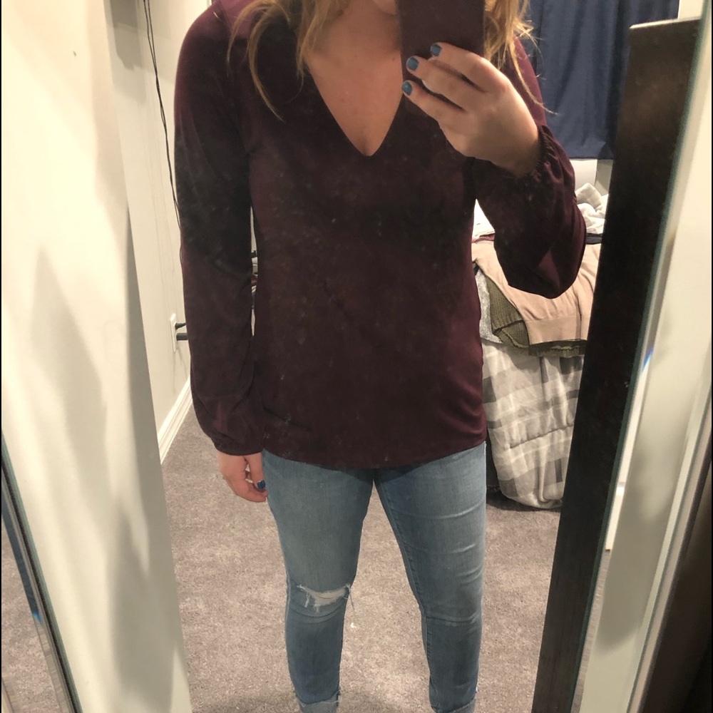 Maroon blouse with laced cut out back.